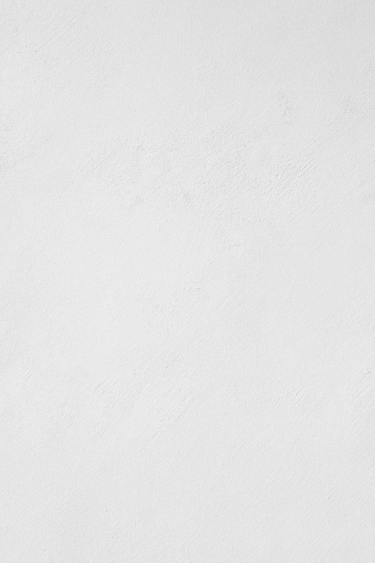 a man riding a snowboard down a snow covered slope