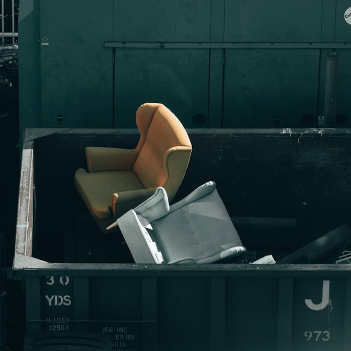 white printer paper on black plastic trash bin