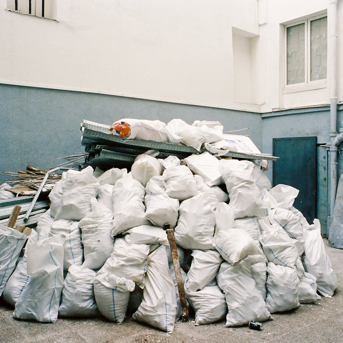 white plastic bags on gray concrete floor