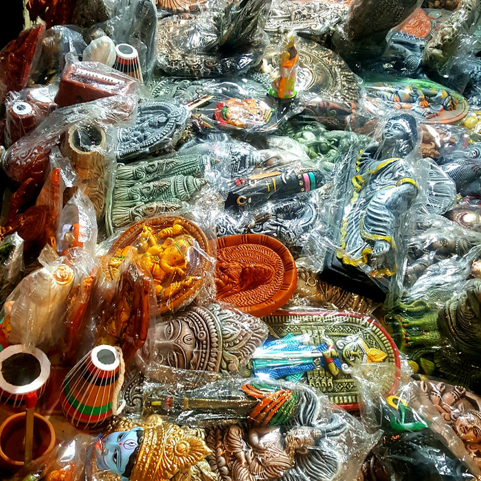 a table filled with lots of different colored vases