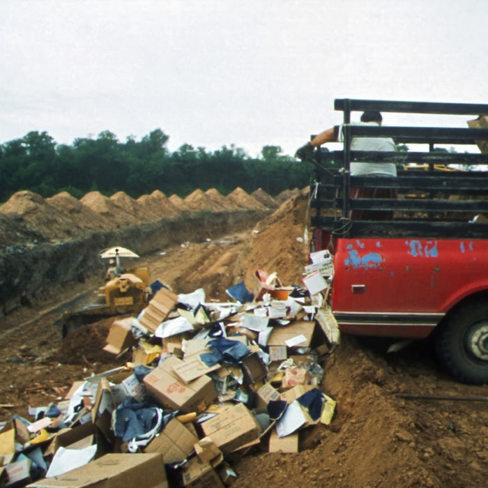 a truck with a pile of wood