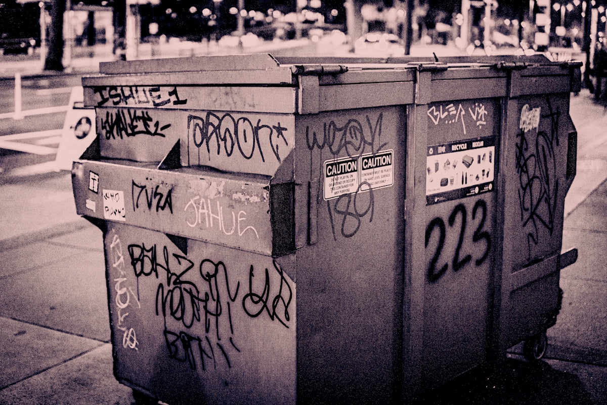 a row of mailboxes with graffiti on them