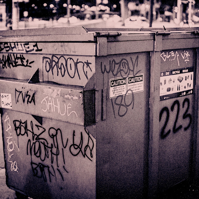 a row of mailboxes with graffiti on them