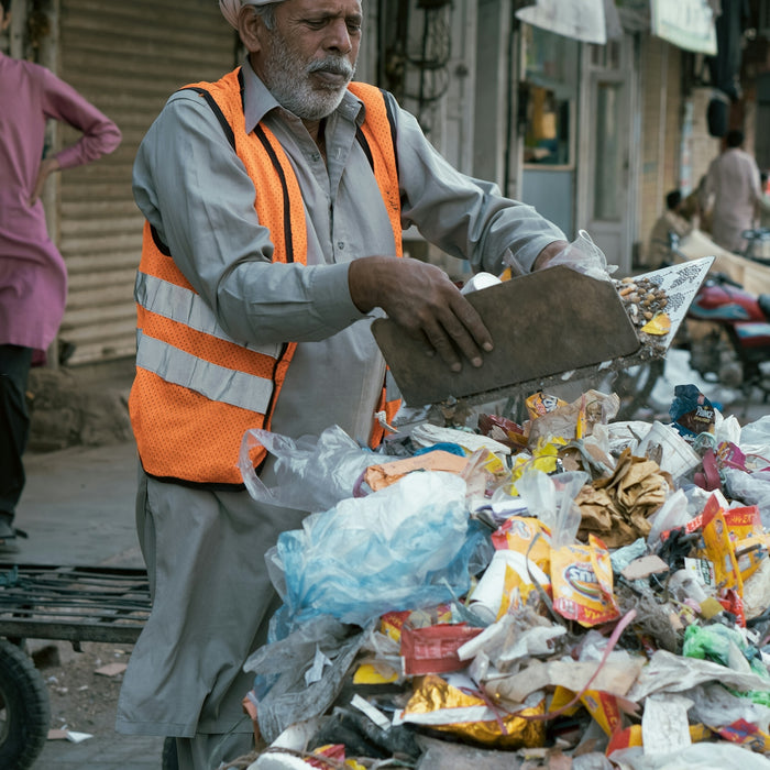a person holding a tray of food