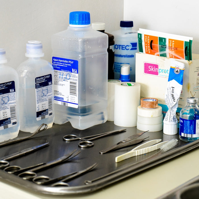 a sink with a bunch of items on top of it