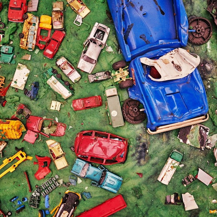 a bunch of toy cars and trucks on the ground