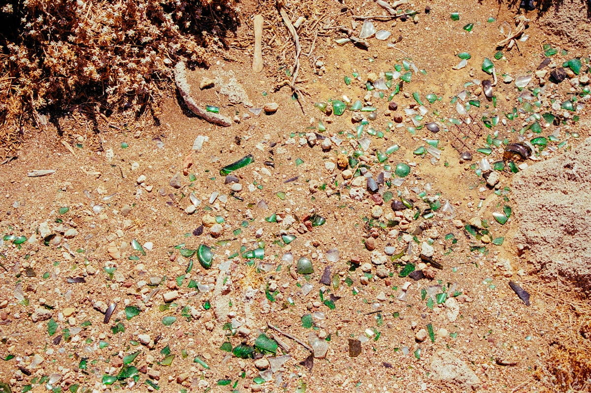 A bunch of broken glass sitting on the ground