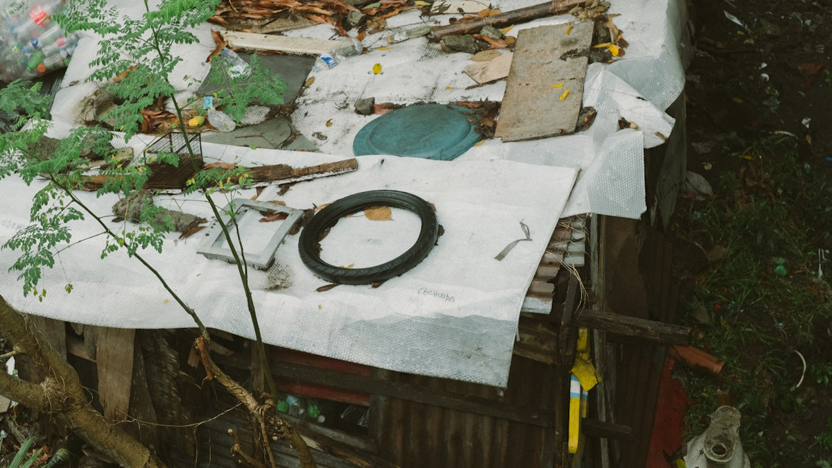 A pile of junk sitting on top of a wooden table