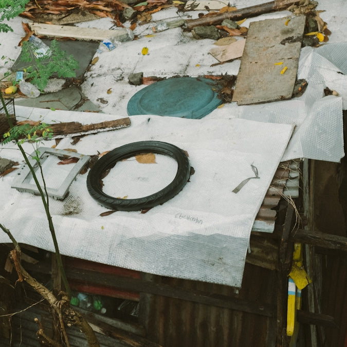 A pile of junk sitting on top of a wooden table