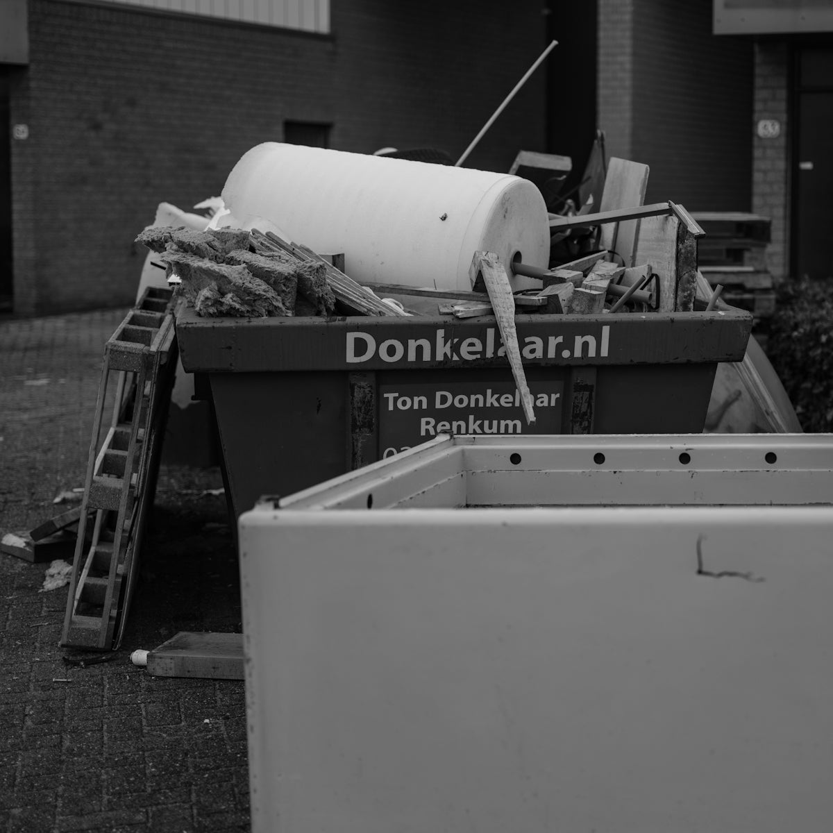 A black and white photo of a pile of trash