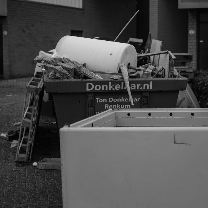 A black and white photo of a pile of trash