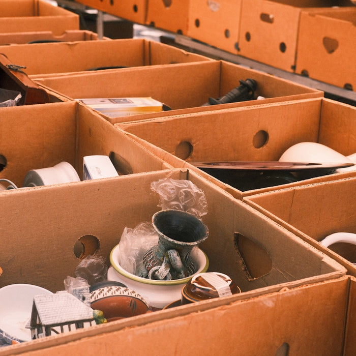 Boxes filled with various items are shown.