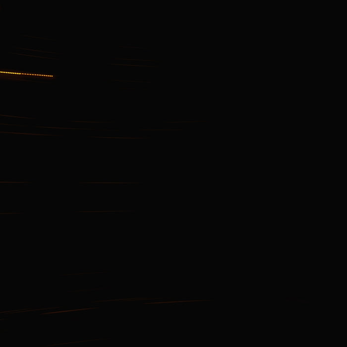 Streaks of light against a dark background